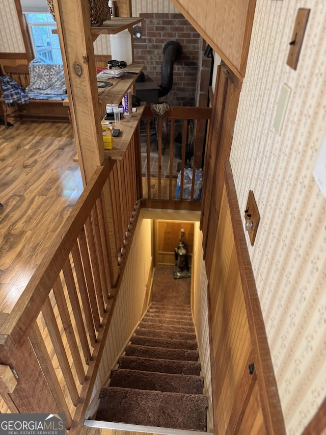 stairway featuring wood finished floors