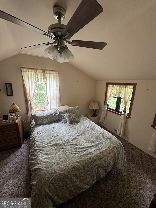 bedroom with a ceiling fan, lofted ceiling, and carpet floors