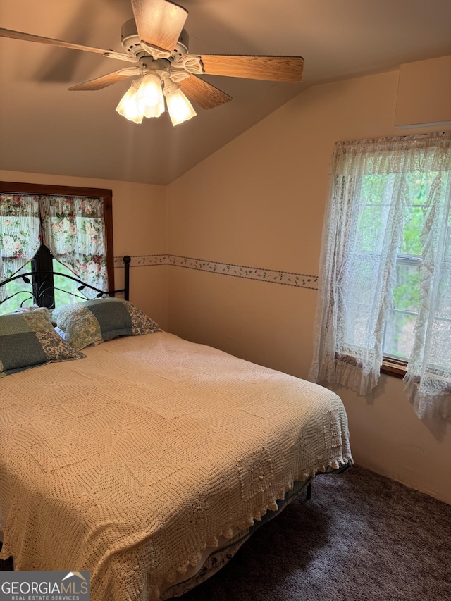 bedroom featuring ceiling fan and lofted ceiling