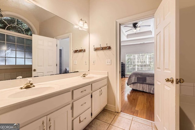 595 Mcgarity Dr, Mcdonough, GA 30252 - bathroom with ensuite bathroom, ceiling fan, a sink, and double vanity