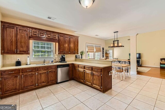 595 Mcgarity Dr, Mcdonough, GA 30252 - kitchen featuring a sink, stainless steel dishwasher, a healthy amount of sunlight, and visible vents
