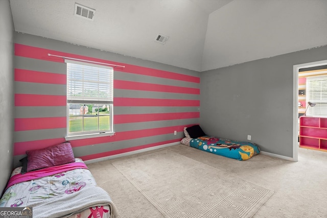 carpeted bedroom featuring vaulted ceiling, visible vents, and multiple windows