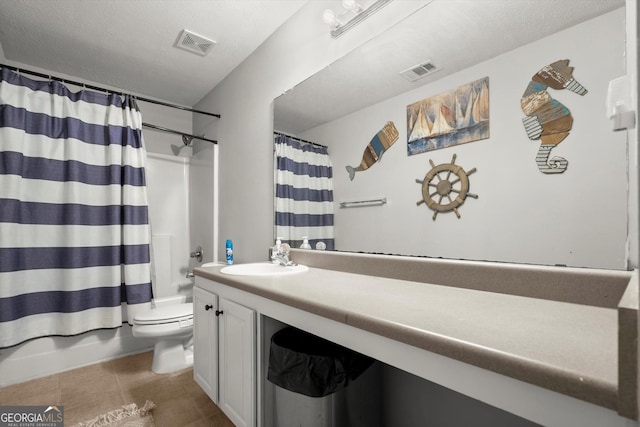 bathroom with vanity, toilet, visible vents, and tile patterned floors