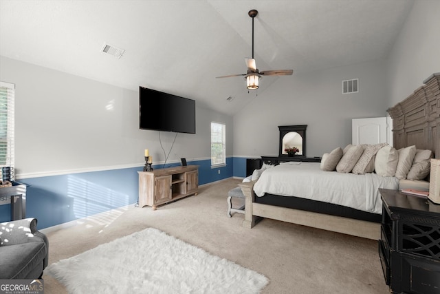 bedroom featuring vaulted ceiling, ceiling fan, carpet floors, and visible vents