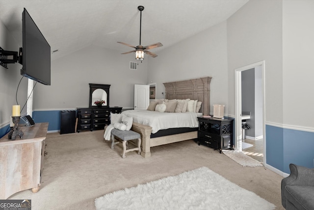bedroom with high vaulted ceiling, visible vents, baseboards, and carpet floors
