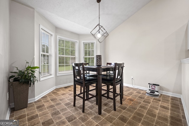 173 Kingswood Dr, Ellenwood, GA 30294 - dining room featuring baseboards and a textured ceiling