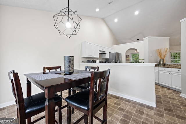 173 Kingswood Dr, Ellenwood, GA 30294 - dining area featuring baseboards, recessed lighting, and high vaulted ceiling