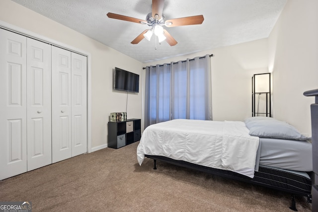 173 Kingswood Dr, Ellenwood, GA 30294 - bedroom featuring baseboards, a closet, ceiling fan, and carpet
