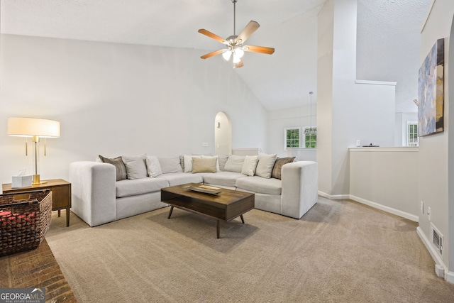 173 Kingswood Dr, Ellenwood, GA 30294 - living area with a ceiling fan, carpet, baseboards, visible vents, and high vaulted ceiling