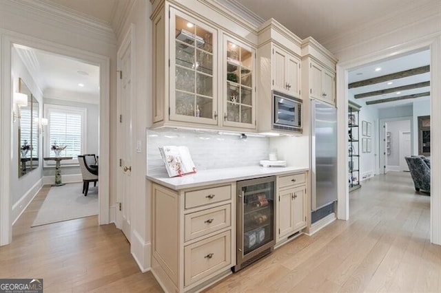 4500 Candacraig, Alpharetta, GA 30022 - bar featuring built in appliances, ornamental molding, light wood-style flooring, and beverage cooler