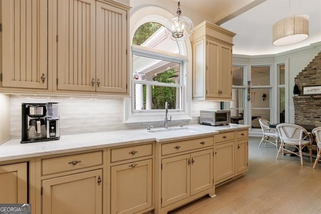 4500 Candacraig, Alpharetta, GA 30022 - kitchen with a sink, a toaster, cream cabinetry, decorative light fixtures, and decorative backsplash
