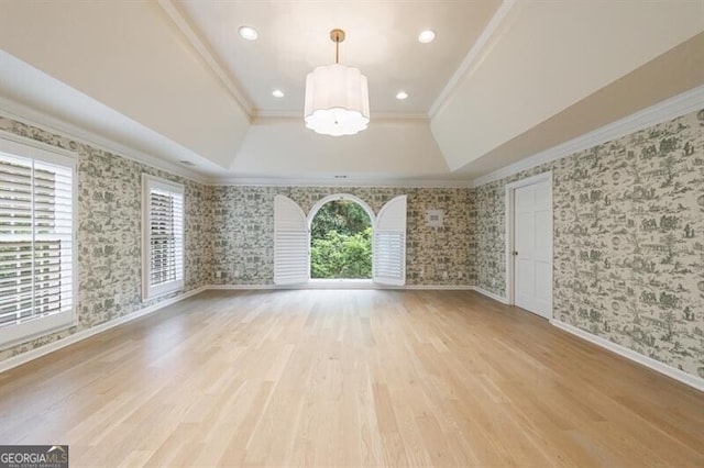 4500 Candacraig, Alpharetta, GA 30022 - empty room featuring ornamental molding, a raised ceiling, a notable chandelier, and light wood-style flooring