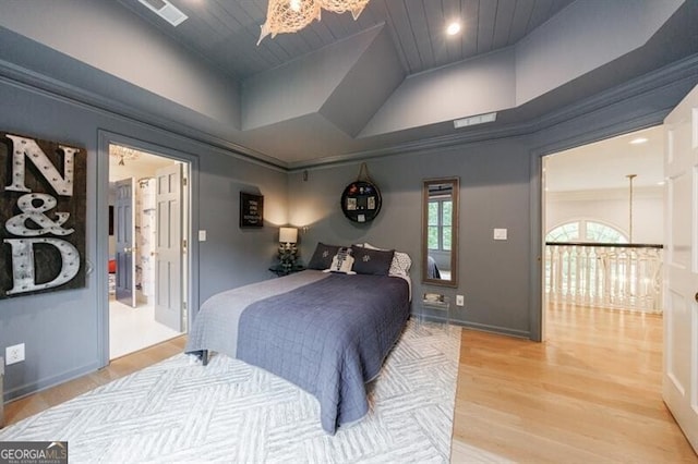 4500 Candacraig, Alpharetta, GA 30022 - bedroom with light wood-type flooring, visible vents, an inviting chandelier, wood ceiling, and baseboards