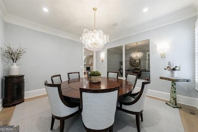 4500 Candacraig, Alpharetta, GA 30022 - dining room featuring a chandelier, wood finished floors, baseboards, and ornamental molding