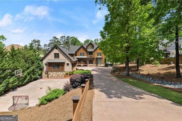 4290 Bobbins Way, Cumming, GA 30041 - craftsman house featuring stone siding and concrete driveway