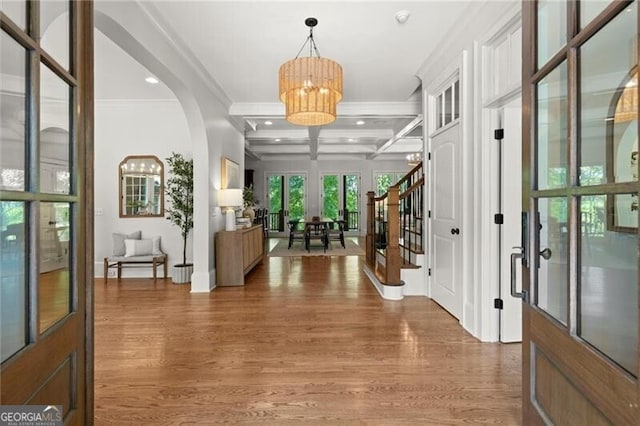 4290 Bobbins Way, Cumming, GA 30041 - entrance foyer with coffered ceiling, a chandelier, ornamental molding, wood finished floors, and stairs