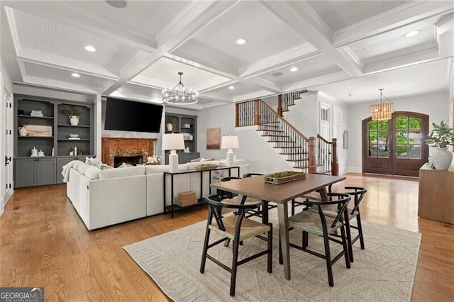 4290 Bobbins Way, Cumming, GA 30041 - dining space with a chandelier, stairs, coffered ceiling, light wood-type flooring, and beam ceiling