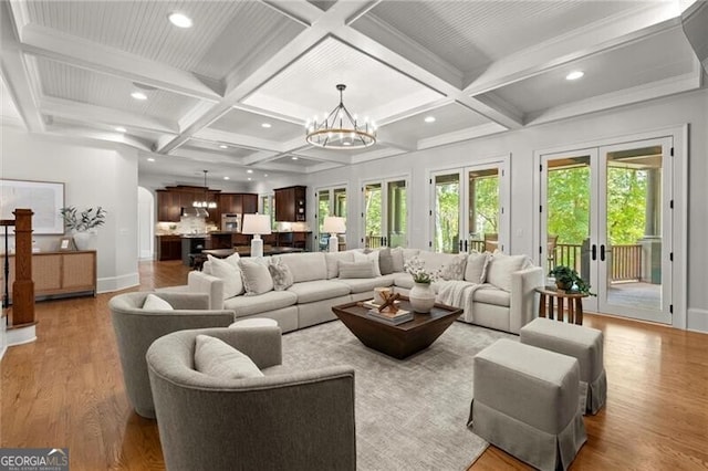 4290 Bobbins Way, Cumming, GA 30041 - living room with coffered ceiling, wood finished floors, a chandelier, beam ceiling, and recessed lighting
