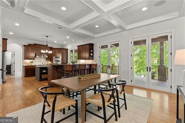 4290 Bobbins Way, Cumming, GA 30041 - dining room with french doors, coffered ceiling, arched walkways, light wood finished floors, and crown molding