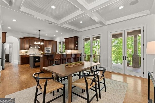 4290 Bobbins Way, Cumming, GA 30041 - dining area featuring french doors, coffered ceiling, crown molding, arched walkways, and recessed lighting