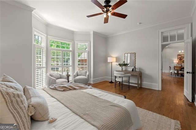 4290 Bobbins Way, Cumming, GA 30041 - bedroom with crown molding, wood finished floors, baseboards, ceiling fan, and arched walkways
