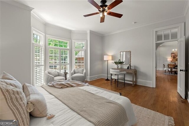 4290 Bobbins Way, Cumming, GA 30041 - bedroom featuring crown molding, wood finished floors, arched walkways, and ceiling fan