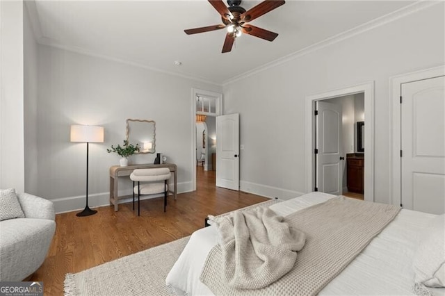 4290 Bobbins Way, Cumming, GA 30041 - bedroom featuring crown molding, baseboards, wood finished floors, connected bathroom, and ceiling fan