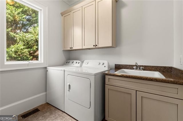 4290 Bobbins Way, Cumming, GA 30041 - clothes washing area with cabinet space, washer and dryer, and light tile patterned flooring