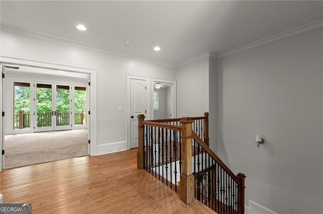 4290 Bobbins Way, Cumming, GA 30041 - hall with an upstairs landing, crown molding, plenty of natural light, light wood-style flooring, and recessed lighting