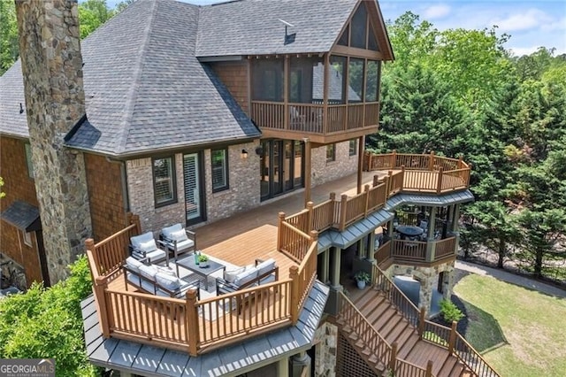 4290 Bobbins Way, Cumming, GA 30041 - rear view of property with roof with shingles, a chimney, a sunroom, and a wooden deck