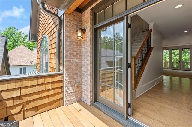 4290 Bobbins Way, Cumming, GA 30041 - property entrance featuring a balcony and brick siding