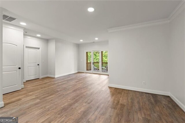 4290 Bobbins Way, Cumming, GA 30041 - spare room with ornamental molding, recessed lighting, and wood finished floors