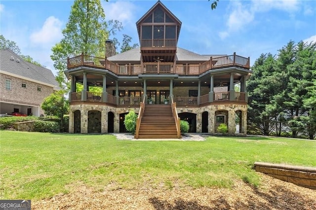 4290 Bobbins Way, Cumming, GA 30041 - rear view of house featuring stairway, stone siding, a lawn, and a balcony
