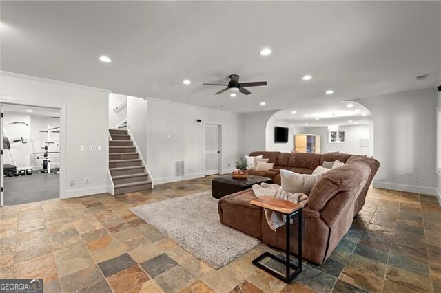 4290 Bobbins Way, Cumming, GA 30041 - living room featuring stone tile flooring, recessed lighting, ceiling fan, stairs, and crown molding