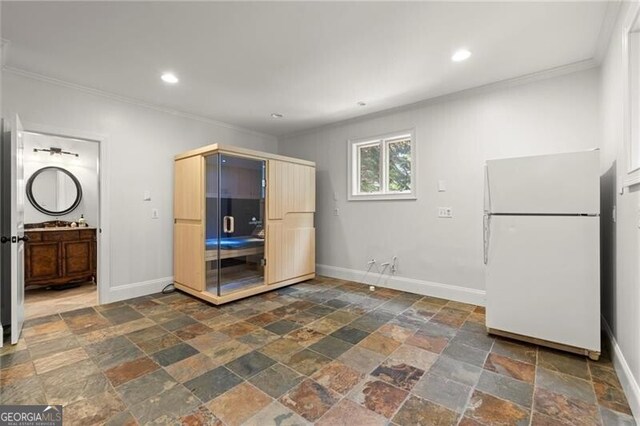 4290 Bobbins Way, Cumming, GA 30041 - kitchen with freestanding refrigerator, crown molding, stone tile floors, and recessed lighting