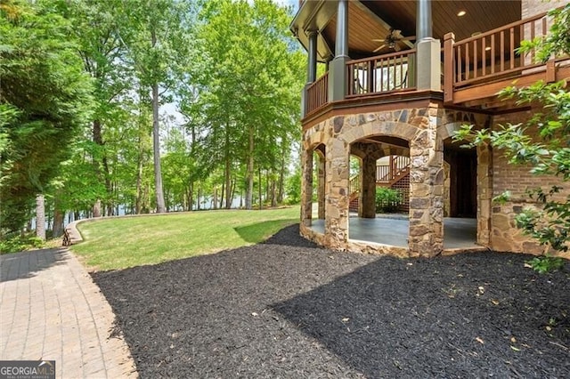 4290 Bobbins Way, Cumming, GA 30041 - view of green lawn with a ceiling fan, a balcony, and a patio