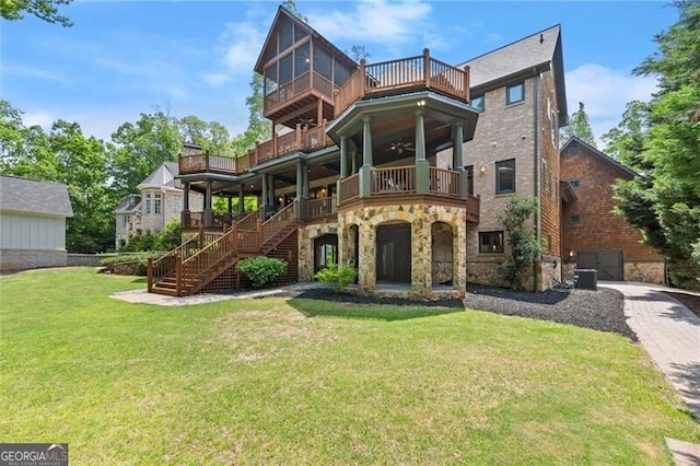 4290 Bobbins Way, Cumming, GA 30041 - view of front of home with a balcony, stone siding, a front yard, central AC, and stairway