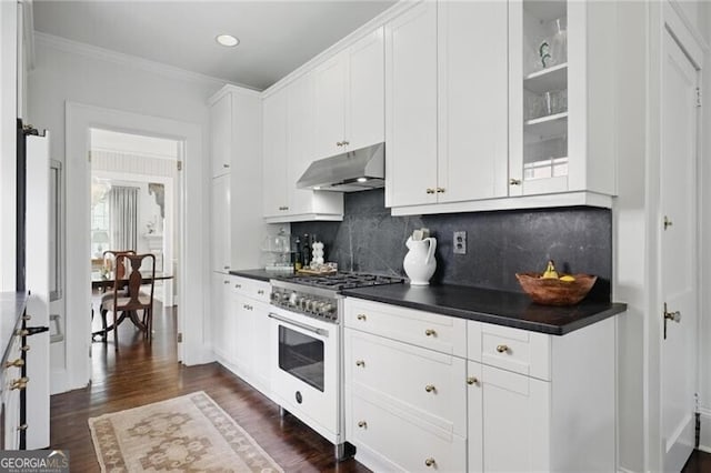 820 Wilson Rd NW, Atlanta, GA 30318 - kitchen with high end stove, dark countertops, dark wood finished floors, backsplash, and under cabinet range hood