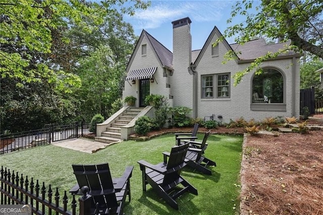 820 Wilson Rd NW, Atlanta, GA 30318 - exterior space featuring fence, brick siding, and a lawn