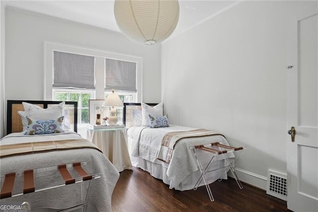 820 Wilson Rd NW, Atlanta, GA 30318 - bedroom with baseboards, ornamental molding, visible vents, and wood finished floors