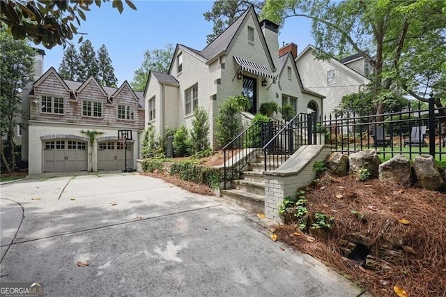 820 Wilson Rd NW, Atlanta, GA 30318 - view of front of house with driveway, an attached garage, and fence