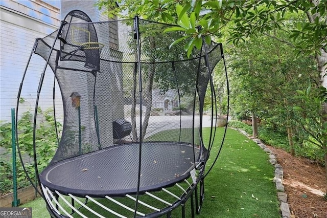 820 Wilson Rd NW, Atlanta, GA 30318 - exterior space featuring a trampoline and fence