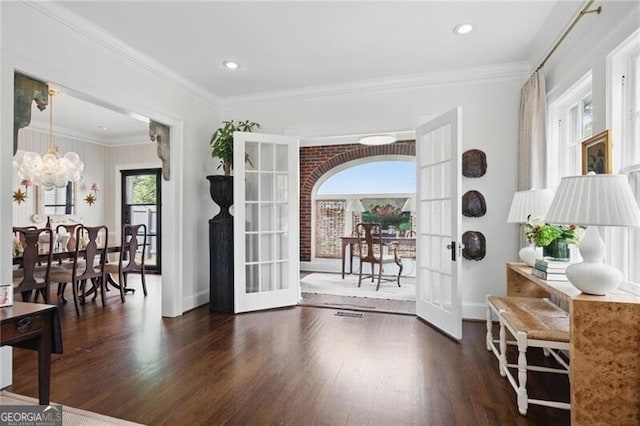 820 Wilson Rd NW, Atlanta, GA 30318 - doorway to outside with crown molding, wood finished floors, french doors, and a notable chandelier