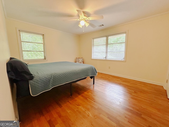 861 Ga Highway 87 N, Cochran, GA 31014 - bedroom with ornamental molding, visible vents, and light wood-style floors