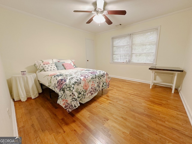 861 Ga Highway 87 N, Cochran, GA 31014 - bedroom with crown molding, light wood-type flooring, visible vents, and baseboards