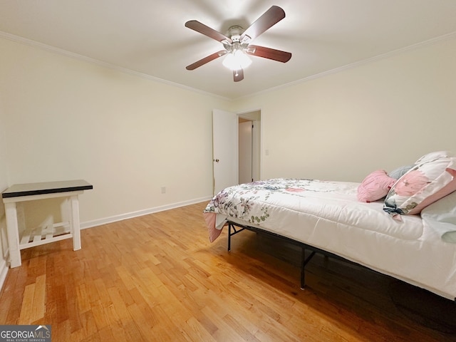 861 Ga Highway 87 N, Cochran, GA 31014 - bedroom with baseboards, ceiling fan, ornamental molding, and light wood-type flooring