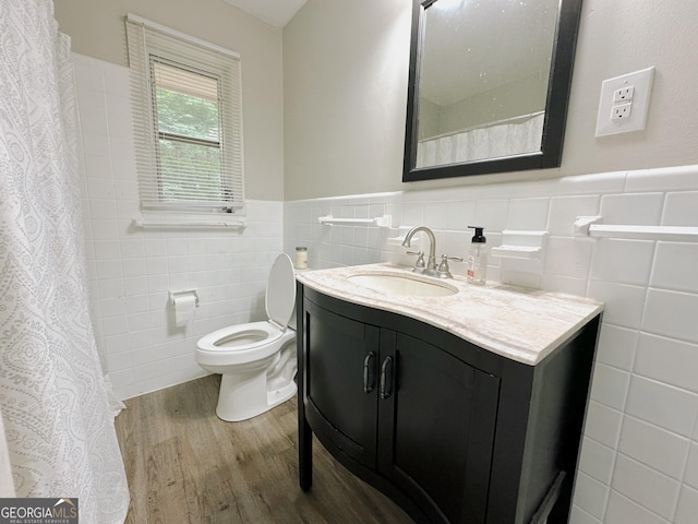 861 Ga Highway 87 N, Cochran, GA 31014 - full bathroom featuring tile walls, toilet, wood finished floors, and wainscoting