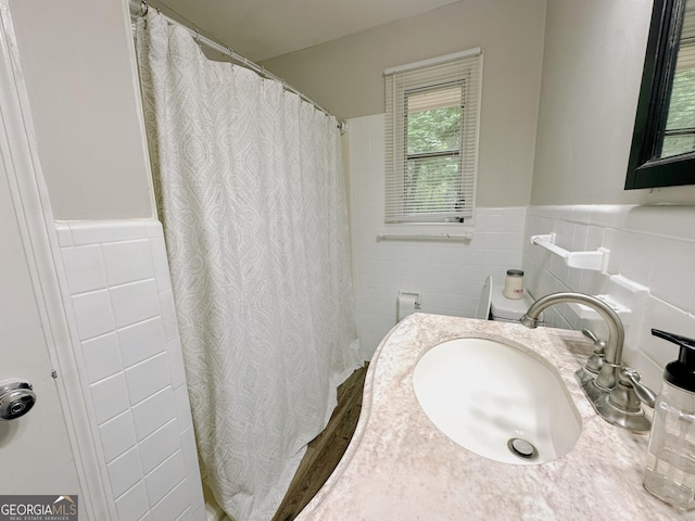 861 Ga Highway 87 N, Cochran, GA 31014 - full bathroom with a shower with curtain, tile walls, a wainscoted wall, and a sink