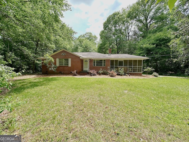861 Ga Highway 87 N, Cochran, GA 31014 - ranch-style house featuring a sunroom, brick siding, a chimney, and a front lawn
