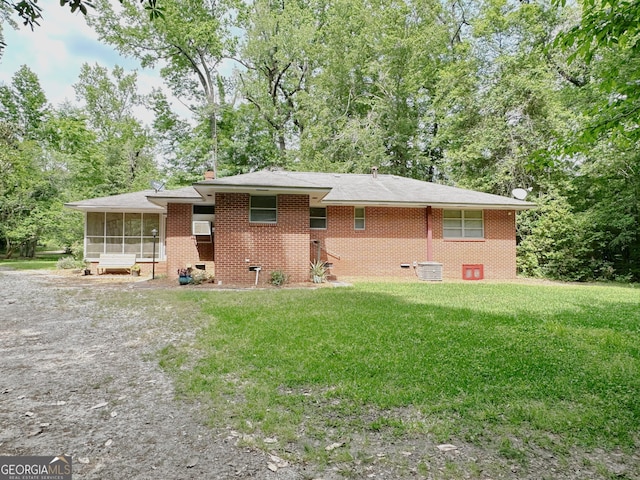 861 Ga Highway 87 N, Cochran, GA 31014 - back of property featuring a yard, a sunroom, and brick siding
